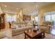 Open living area featuring tile floors, neutral walls, comfortable seating and a dining area at 2542 Cortenova Ct, Venice, FL 34292
