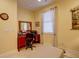 Comfortable office with tile floors, a large window, and neutral decor at 2542 Cortenova Ct, Venice, FL 34292