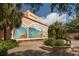 The Venice Theatre featuring a colorful mural, enhancing the appeal with artistic flair and lush surroundings at 2542 Cortenova Ct, Venice, FL 34292