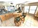 Home bar with natural-wood bar and stools, and a mirrored back wall at 262 Mariner Dr, North Port, FL 34287