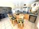 Entertaining space with home bar, natural-wood bar top, stools, mirrored wall, and mini fridge at 262 Mariner Dr, North Port, FL 34287