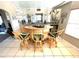 Charming bar area featuring rattan barstools, mirrored backdrop, and well-stocked counter at 262 Mariner Dr, North Port, FL 34287