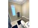 Bathroom featuring a toilet, grab bar, and an adjacent shower with a window at 262 Mariner Dr, North Port, FL 34287
