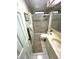 Cozy bathroom featuring a tiled shower, toilet, vanity with sink and neutral earth tone color palette at 262 Mariner Dr, North Port, FL 34287