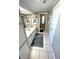 Long bathroom with a sink, seashell art, and a view into the shower room at 262 Mariner Dr, North Port, FL 34287