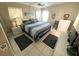 Cozy bedroom with stylish blue bedding and ample natural light at 262 Mariner Dr, North Port, FL 34287