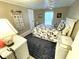 Cozy bedroom with nautical themed decorations and a ceiling fan at 262 Mariner Dr, North Port, FL 34287