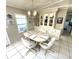Neutral dining room boasts an elegant hutch, natural light, and comfortable seating at 262 Mariner Dr, North Port, FL 34287
