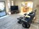 Spacious living room featuring tile floors and an adjacent dining area at 262 Mariner Dr, North Port, FL 34287