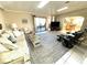 Open concept living room with access to the kitchen and lanai at 262 Mariner Dr, North Port, FL 34287