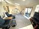 Bright and airy living room with tile floors and a sliding glass door to the lanai at 262 Mariner Dr, North Port, FL 34287