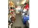 Cluttered storage room with shelves, a washer/dryer, and miscellaneous household items at 262 Mariner Dr, North Port, FL 34287