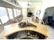 Cozy sunroom with bar area, ample natural light, and comfortable seating at 262 Mariner Dr, North Port, FL 34287