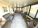 Spacious sunroom with neutral decor and comfortable seating areas at 262 Mariner Dr, North Port, FL 34287