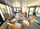 Enclosed porch with wicker furnishings and natural light at 262 Mariner Dr, North Port, FL 34287