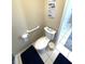 Toilet and grab bar inside the bathroom at 262 Mariner Dr, North Port, FL 34287