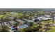 Aerial view of tennis courts, pickleball, and golf course at 269 Southampton Dr # 303, Venice, FL 34293