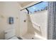 This bathroom shower features bright natural light from the unique glass block window above at 269 Southampton Dr # 303, Venice, FL 34293
