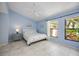 This is a calming bedroom that features an ensuite bathroom and ample natural light at 269 Southampton Dr # 303, Venice, FL 34293