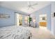 Bright bedroom with tile flooring, fan, and ensuite bathroom at 269 Southampton Dr # 303, Venice, FL 34293