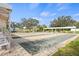 Bocce ball courts surrounded by mature trees and landscaping at 269 Southampton Dr # 303, Venice, FL 34293