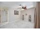 Neutral office or den with tile flooring, ceiling fan, and ample closet space at 269 Southampton Dr # 303, Venice, FL 34293