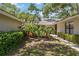 Charming home featuring lush landscaping, walkway, and a welcoming entrance at 269 Southampton Dr # 303, Venice, FL 34293