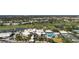 Scenic aerial view of a golf course, community buildings, and residential homes, blending leisure and living at 269 Southampton Dr # 303, Venice, FL 34293