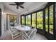 Lanai with views of the backyard, seating, and ceiling fan at 269 Southampton Dr # 303, Venice, FL 34293