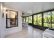 Enclosed lanai featuring bright, natural light and neutral colored tiles at 269 Southampton Dr # 303, Venice, FL 34293