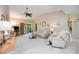 Inviting living room with neutral colors, comfortable sofa, tile floors, and access to outdoor patio at 269 Southampton Dr # 303, Venice, FL 34293