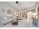 Cozy living room with tile floors, comfortable seating and ample natural light at 269 Southampton Dr # 303, Venice, FL 34293