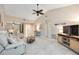 Bright living room featuring neutral tones, ceiling fan, tile floors, and comfortable seating at 269 Southampton Dr # 303, Venice, FL 34293