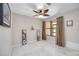 Neutral room featuring tile flooring, a window with curtains, and decorative wall mirrors at 269 Southampton Dr # 303, Venice, FL 34293