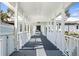 Covered walkway with white railings and columns to main building at 269 Southampton Dr # 303, Venice, FL 34293