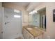 Bathroom featuring a granite countertop and walk-in shower at 271 Manor Rd, Venice, FL 34293