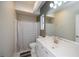 Clean bathroom with shower/tub, modern vanity, and ample lighting at 271 Manor Rd, Venice, FL 34293