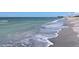 Beautiful beach with gentle waves and clear, turquoise-colored water at 271 Manor Rd, Venice, FL 34293
