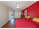 Large bedroom with pool view, wood floors, a ceiling fan, and access to a sliding glass door at 271 Manor Rd, Venice, FL 34293