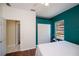 Relaxing bedroom with accent wall, ceiling fan, and large closet at 271 Manor Rd, Venice, FL 34293