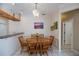 Dining room with a classic chandelier, table, and seating for six at 271 Manor Rd, Venice, FL 34293