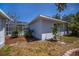 Exterior view of home with a screened pool and mature landscaping at 271 Manor Rd, Venice, FL 34293