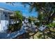 Charming home exterior with inviting front yard seating, lush landscaping, and a paver walkway at 271 Manor Rd, Venice, FL 34293
