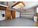 Large garage with storage, epoxy flooring, and garage door at 271 Manor Rd, Venice, FL 34293