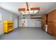 Spacious garage featuring a utility sink, washer/dryer, and ample storage space at 271 Manor Rd, Venice, FL 34293