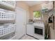 Functional laundry room equipped with a washer, dryer, and storage at 271 Manor Rd, Venice, FL 34293