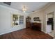 Bright living room featuring wood floors, a chandelier, and natural light from the window at 271 Manor Rd, Venice, FL 34293