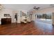 Bright and airy living room showcasing hardwood floors, comfortable seating, and a view of the pool area at 271 Manor Rd, Venice, FL 34293