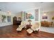 Spacious living room with hardwood floors, comfortable seating, and elegant decor, ideal for relaxation and gatherings at 271 Manor Rd, Venice, FL 34293