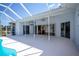 Spacious covered patio perfect for entertaining with access to the outdoor pool at 271 Manor Rd, Venice, FL 34293